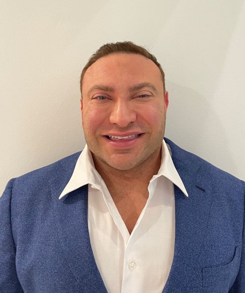 Smiling man in blue blazer